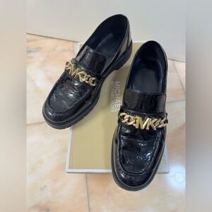 Michael Kors Glossy Black Loafers with Gold Accent